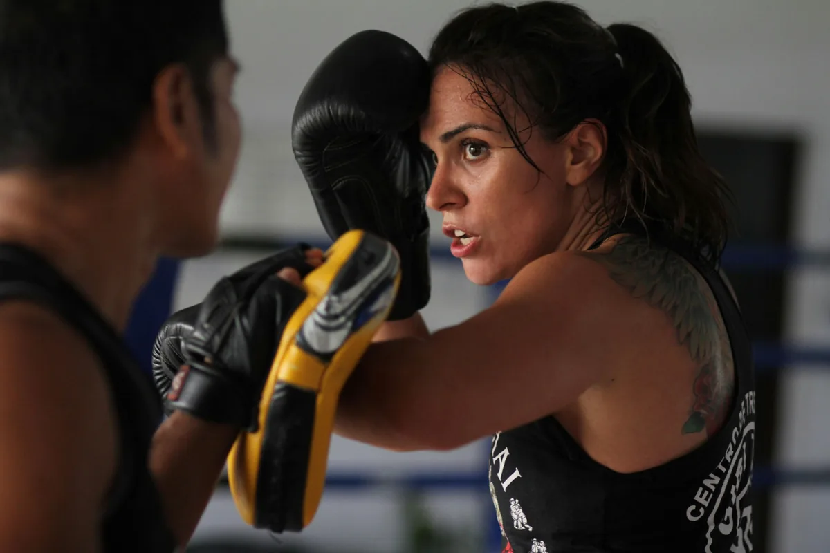 Combat athlete drilling mitt work during fight camp