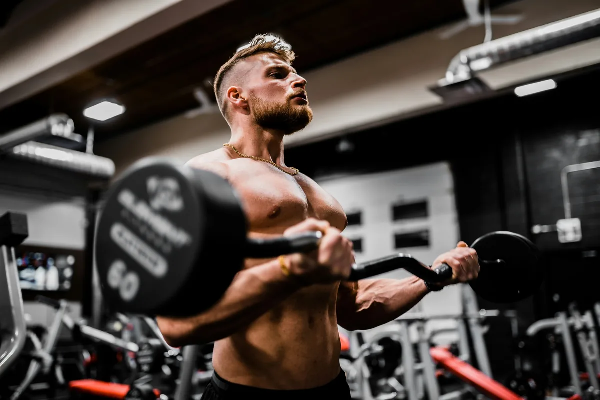 Strength athlete performing barbell curls